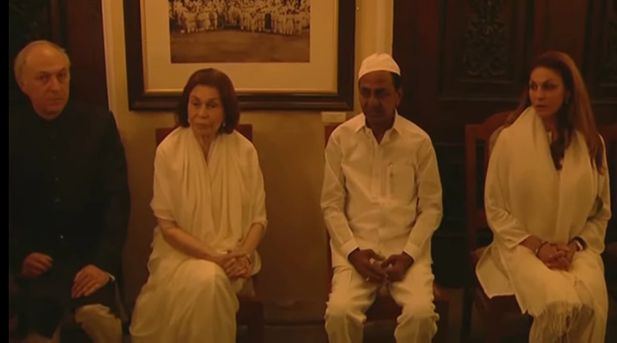 Azmat Jha (L), along with his family