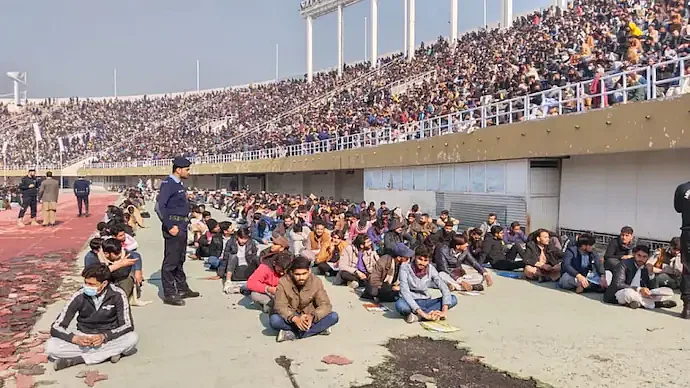 WATCH: It's a match? It's a concert? People gather at Pakistani stadium for police written test  | Twitter
