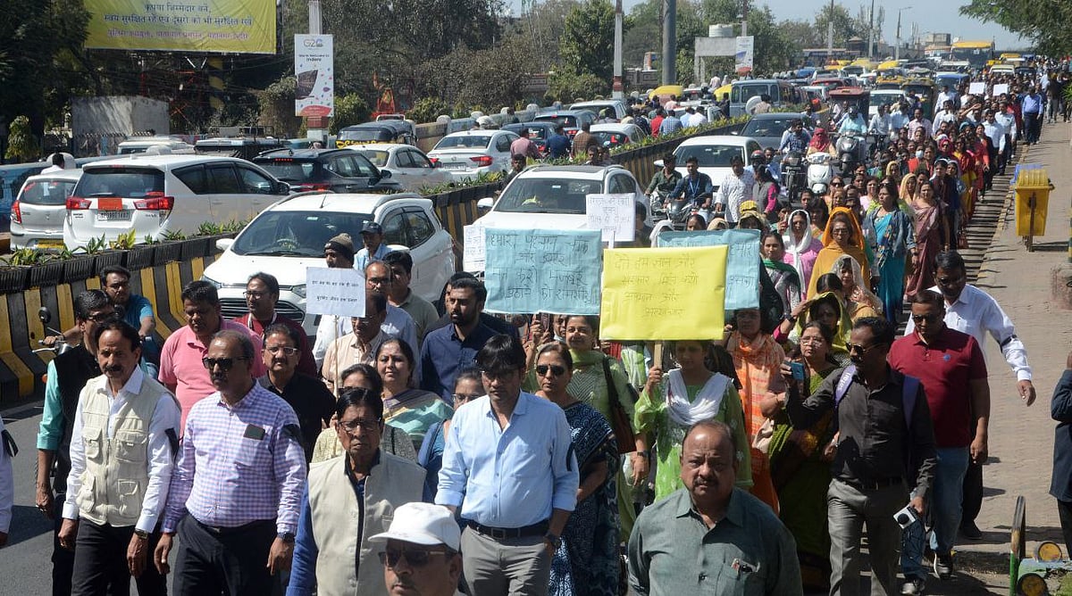 College principals and teachers take out rally from Gandhi Hall to Regal Square on Wednesday