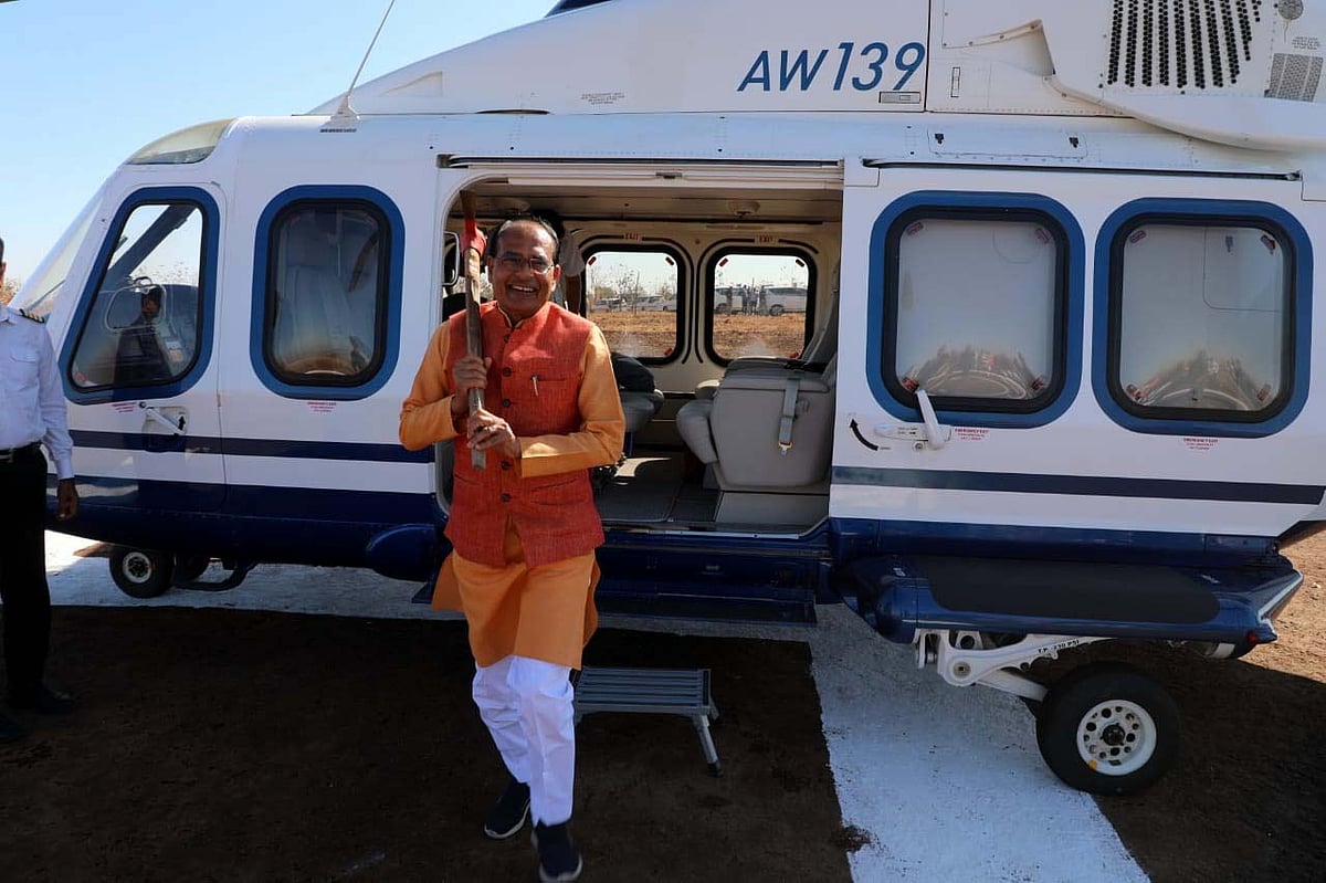 CM Shivraj Singh Chouhan alights from chopper holding gaiti on shoulder in Jhabua on Sunday | FP