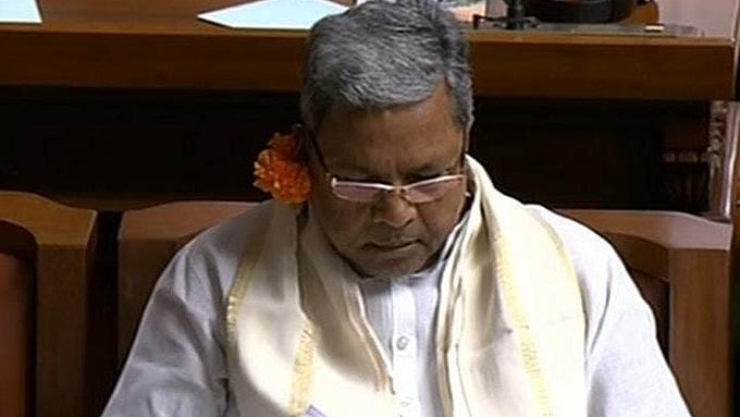 Karnataka: Former CM Siddaramaiah, Cong leaders don flowers as part of 'Kivi Mele Hoovu' campaign in Assembly