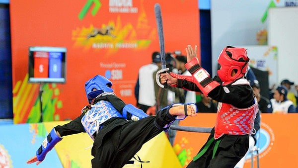  Kartikey Katoohi(Himachal Pradesh) vs. KH. Bebek Singha(Assam) in action in -56KG category of ThangTa