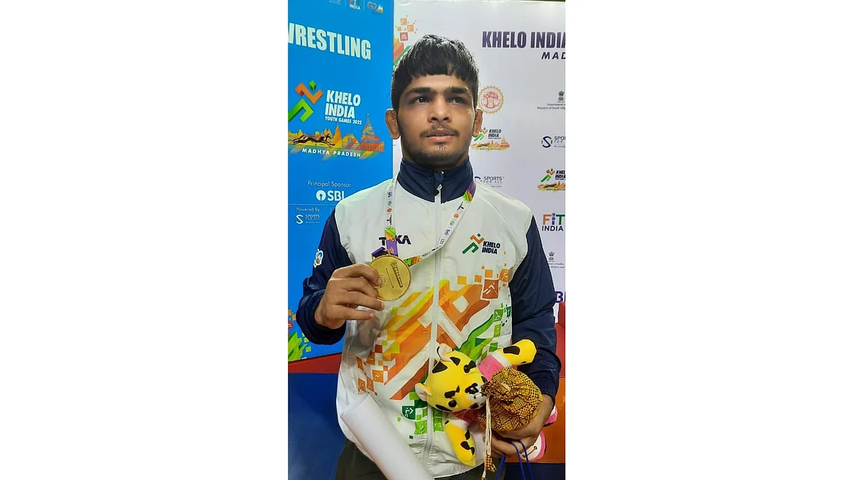 Wrestler Abhishek Yadav (Madhya Pradesh) with his gold medal in 51 kg category
