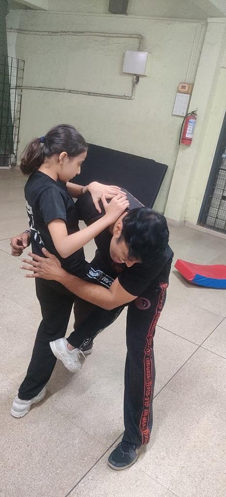 A good knee kick will make him go down with pain