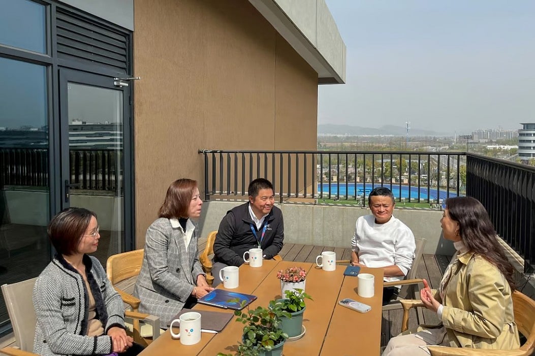 Jack Ma, second from right, visited the school in Hangzhou on Monday