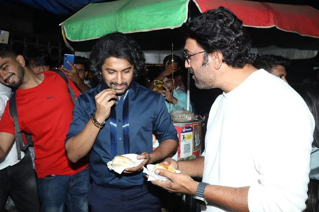 Nani savouring vada pav with Sharad Kelkar on the streets of Mumbai