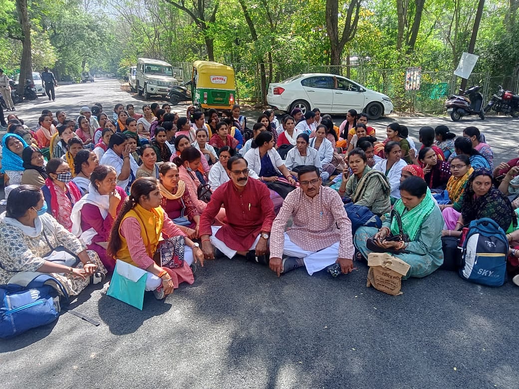 Auxiliary Nursing Midwives protest outside health min's residence after new amendment mandates Biology for recruitment
