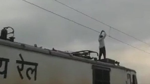 UP: Man climbs on top Mumbai-Gorakhpur Express touches high-voltage ...