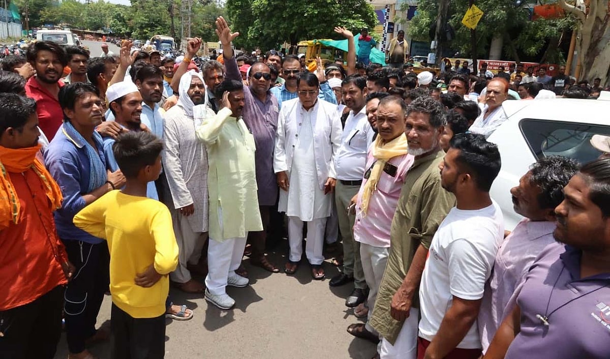 Congress MLA PC Sharma with vegetable vendors who were shifted from New Market on Sunday.