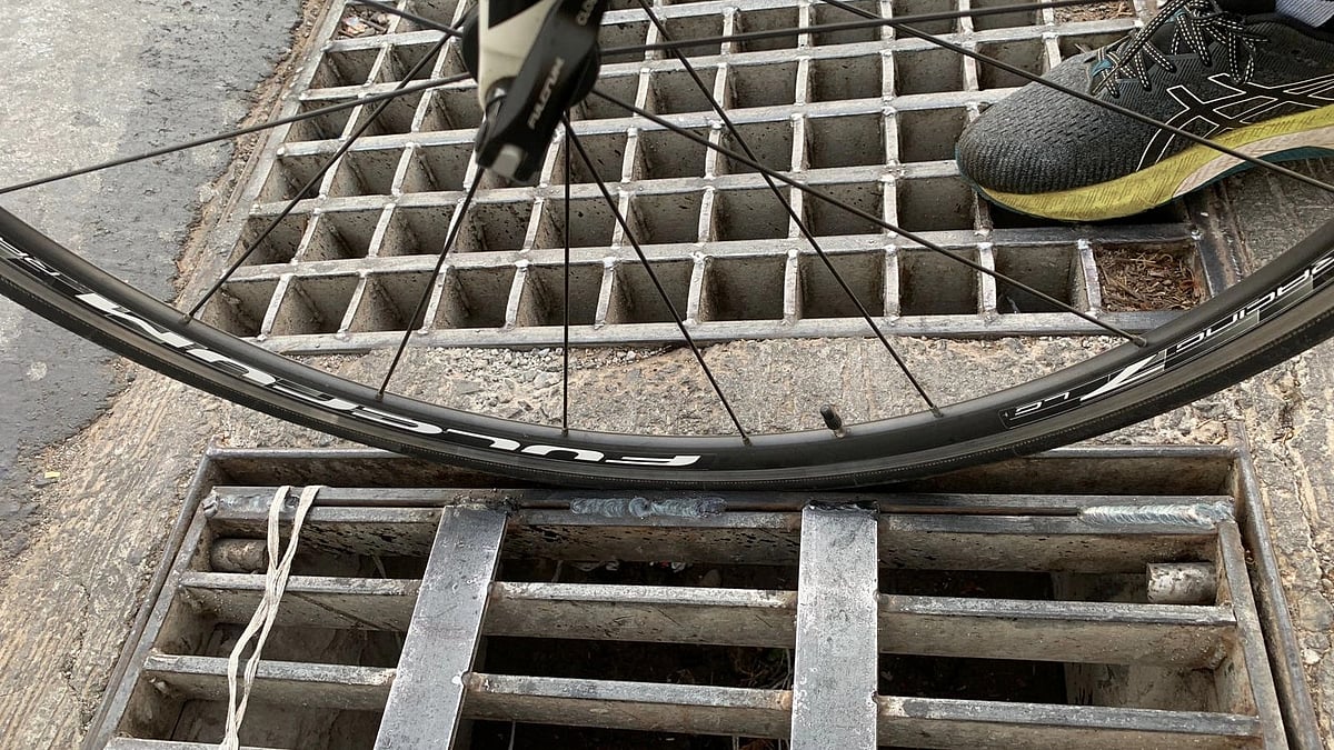 Tyre still going into the narrower gap fixed by BMC post accident on B G Kher Marg leading to Kemps Corner from Hanging Garden.