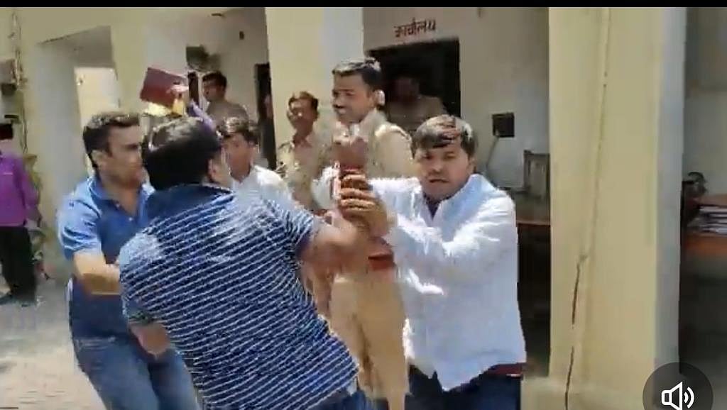 SP MLA thrashes BJP leader's husband in police station | Twitter video screengrab