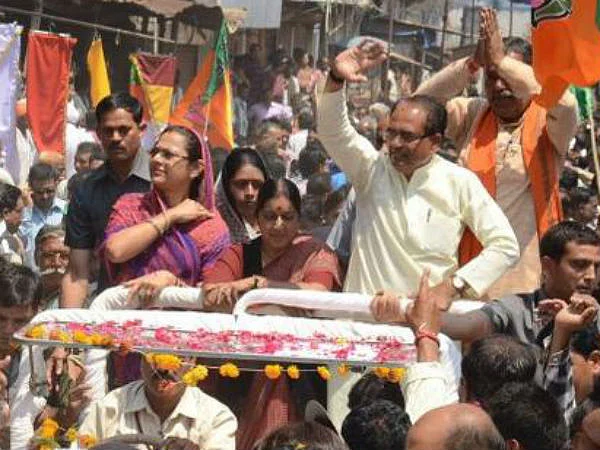Sadhan accompanies CM Chouhan to public rally