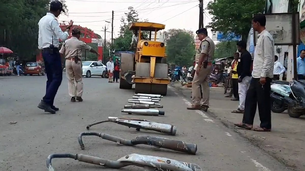 WATCH: MP's Mandla district traffic police crushes modified bike silencers with road roller, issues challans 