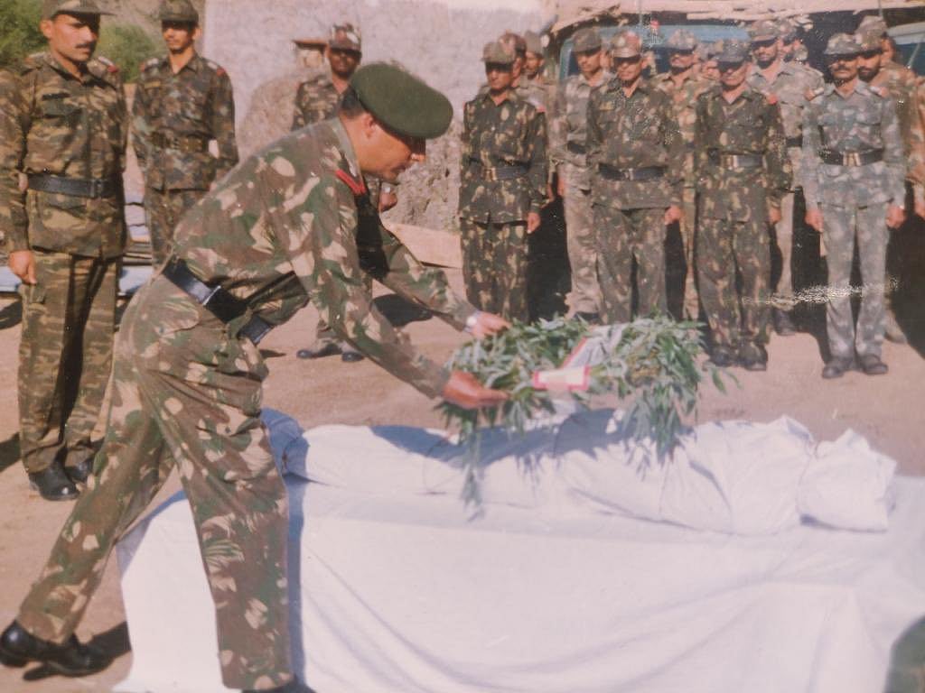 Indian Soldiers paying respects to a deceased during Kargil War 1999.