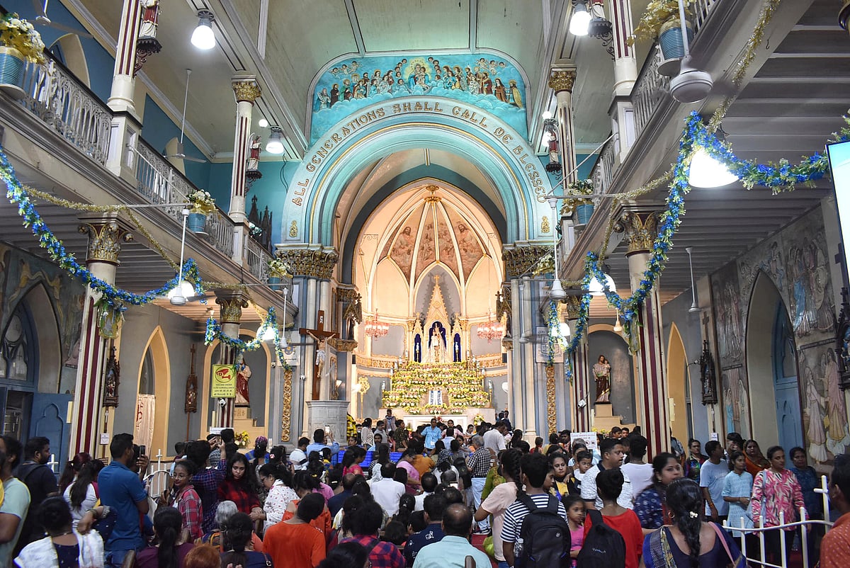 Families come together to attend the feast mass at the historic Basilica.