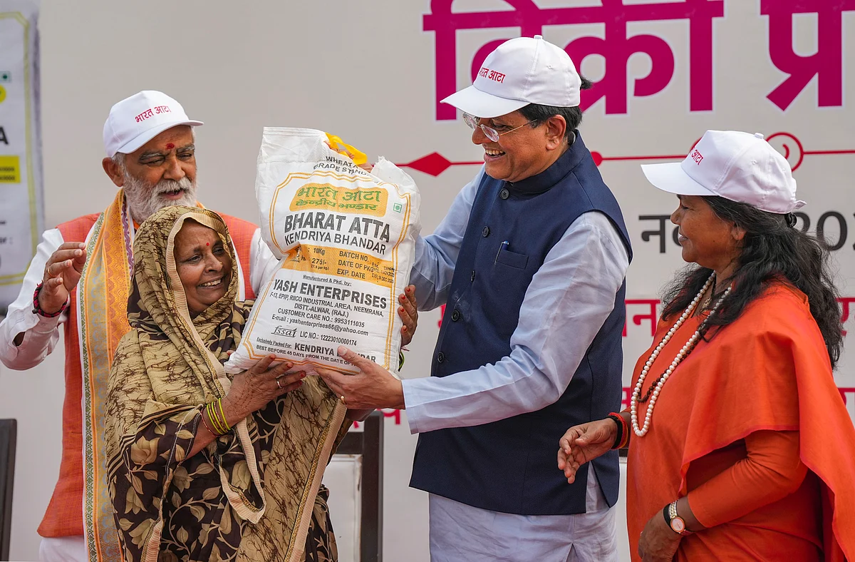 Union Minister for Consumer Affairs, Food and Public Distribution Piyush Goyal with Ministers of State hands over a packet to a beneficiary at the launch of Sale of Bharat Atta at Kartavya Path, India Gate, in New Delhi, Monday, Nov. 6, 2023.