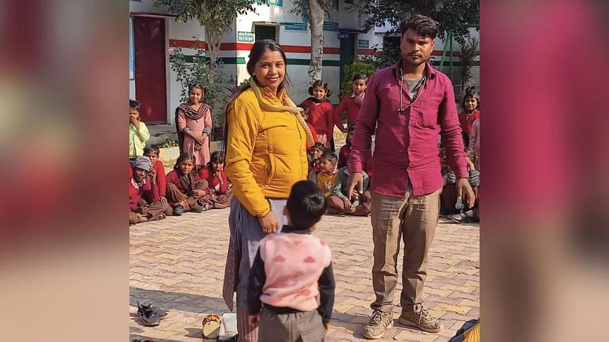 Teacher with the snake charmer and kids
