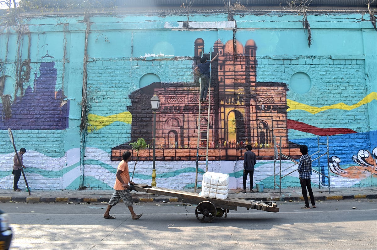 Students of JJ School of Art paint Gateway of India on wall under the Mumbai Beautification Project at P D'mello Road
