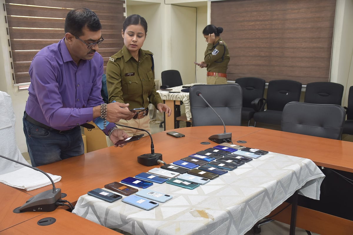  Cops arrange the mobile phones before returning them to their owners in Ujjain on Thursday 