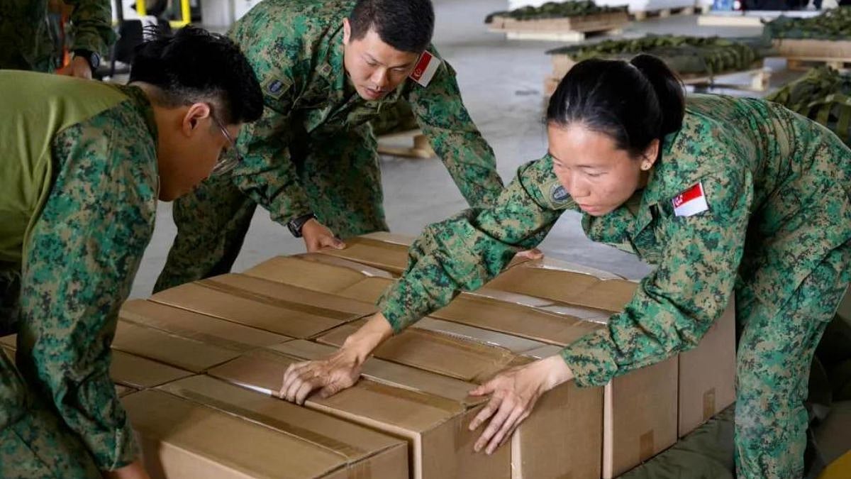 Singapore Air Force mission crew packing Gaza aid before the airdop operation. Photo courtesy: Facebook/The Republic of Singapore Air Force