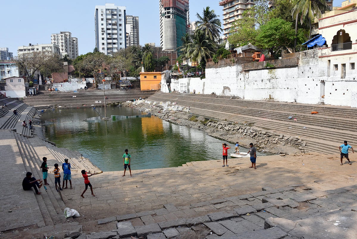 Cricket enthusiasts playing at Banganga Tank where the renovation work
is going on, in Mumbai 
