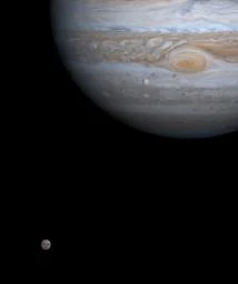 NASA's Cassini spacecraft on Dec. 7, 2000, just as two of Jupiter's four major moons, Europa and Callisto, were nearly perfectly aligned with each other and the center of the planet.