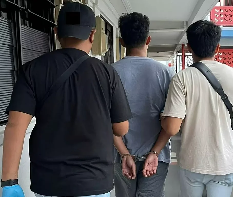CNB officers arrested a suspected drug offender in an islandwide drug operation. Photo courtesy: CNB