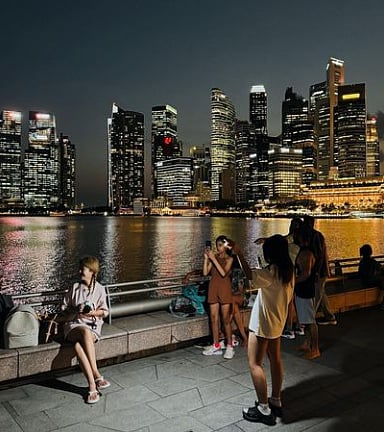 People at the Waterfront Promenade in Singapore. Quality of life is a key factor in the annual World Competitiveness Ranking.