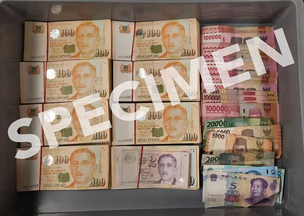 A huge amount of undeclared cash was found on a traveller at the Changi Airport Terminal 1 in Singapore. Photo courtesy: Facebook/ Immigration & Checkpoints Authority
|