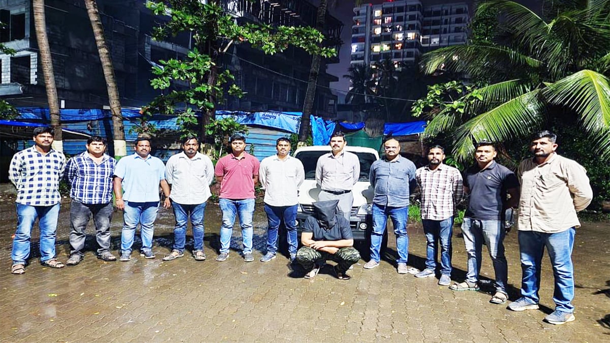 The accused and the stolen car recovered by the police | 