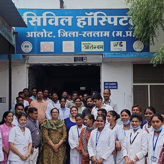 Staff standing outside hospital | 