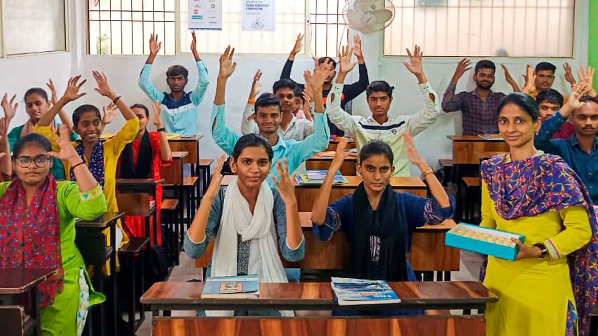 Geeta ( In yellow dress) celebrates with batchmates after clearing Class 8 exam in first division, in Aurangabad on Wednesday     | PTI
