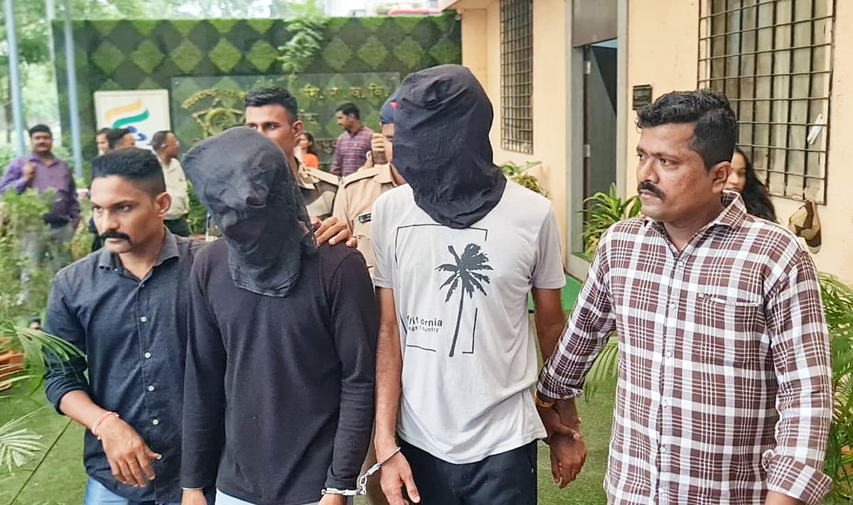 The self proclaimed editor and his accomplice in police custody |