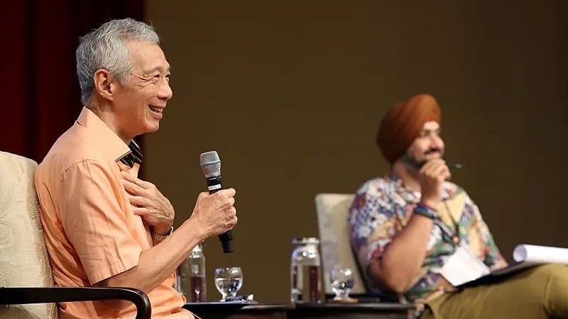 Singapore Senior Minister and former Prime Minister Lee Hsien Loong speaks at the HarmonyWorks! Conference on August 3, 2024. With him on the stage is session moderator and conference organising committee chairman Sarabjeet Singh. Photo courtesy: X/@leehsienloong
 | 