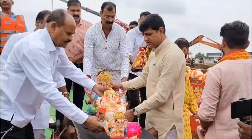 Ganpati Visarjan going on at in a pond near Indore's Jawahar Tekri on Wednesday.