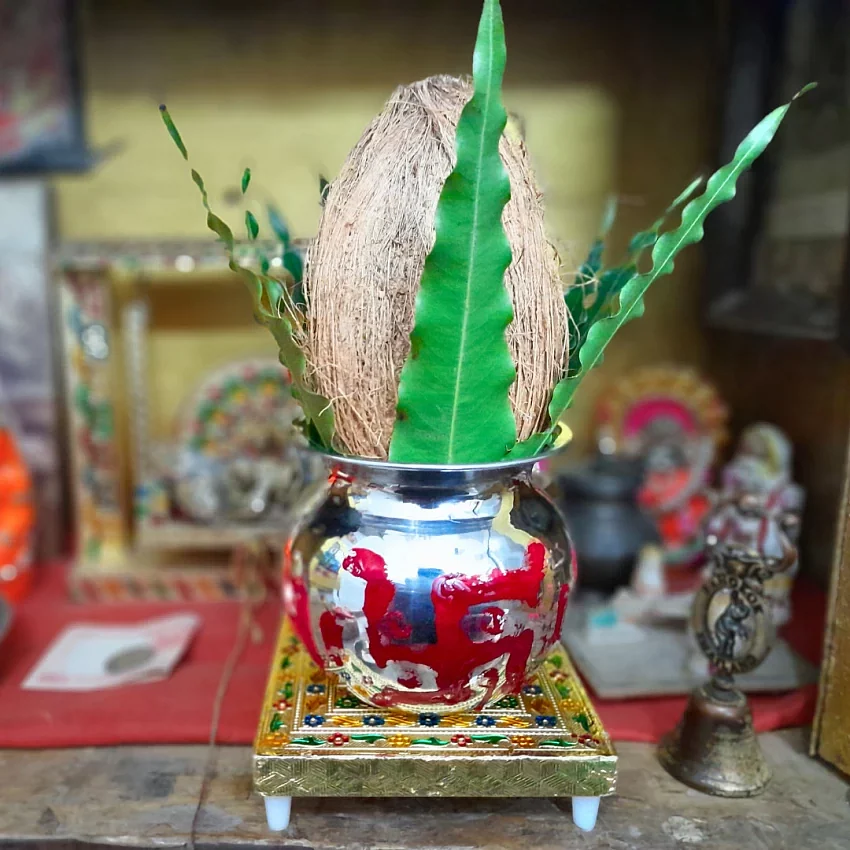 placing the prepared kalash on the place of puja