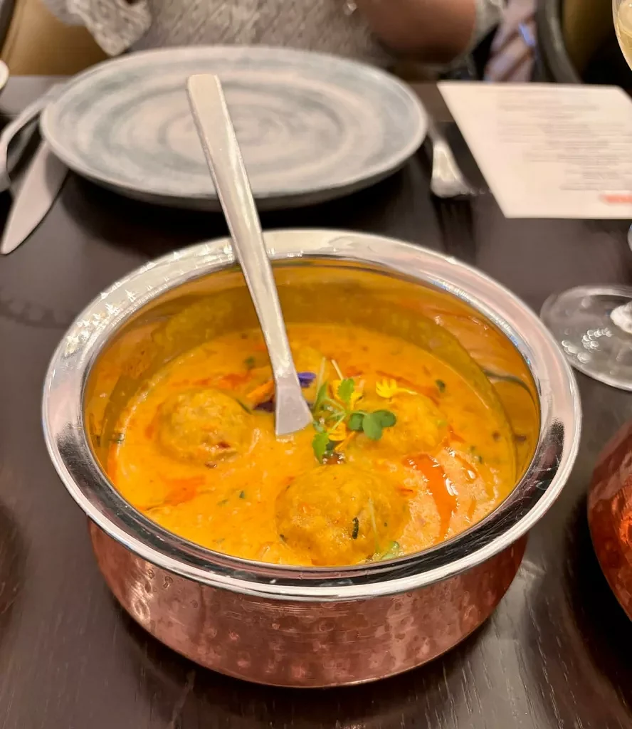 Govind Gatta Curry, a main dish of chickpea dumplings served in a rich curry comprising yoghurt, coriander and spices. Photo: Connected to India