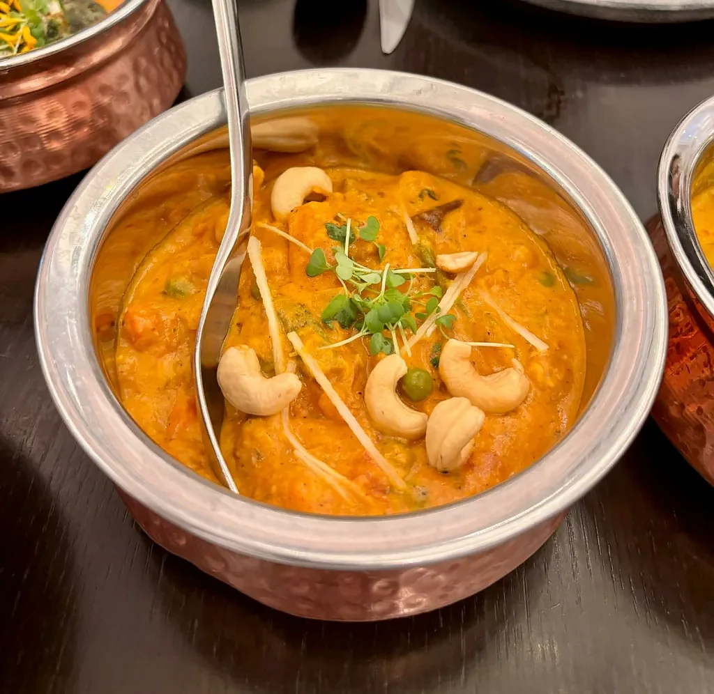 Creamy Subz Kaju Coconut Curry, with baby corn, snow peas, and carrots. Photo: Connected to India