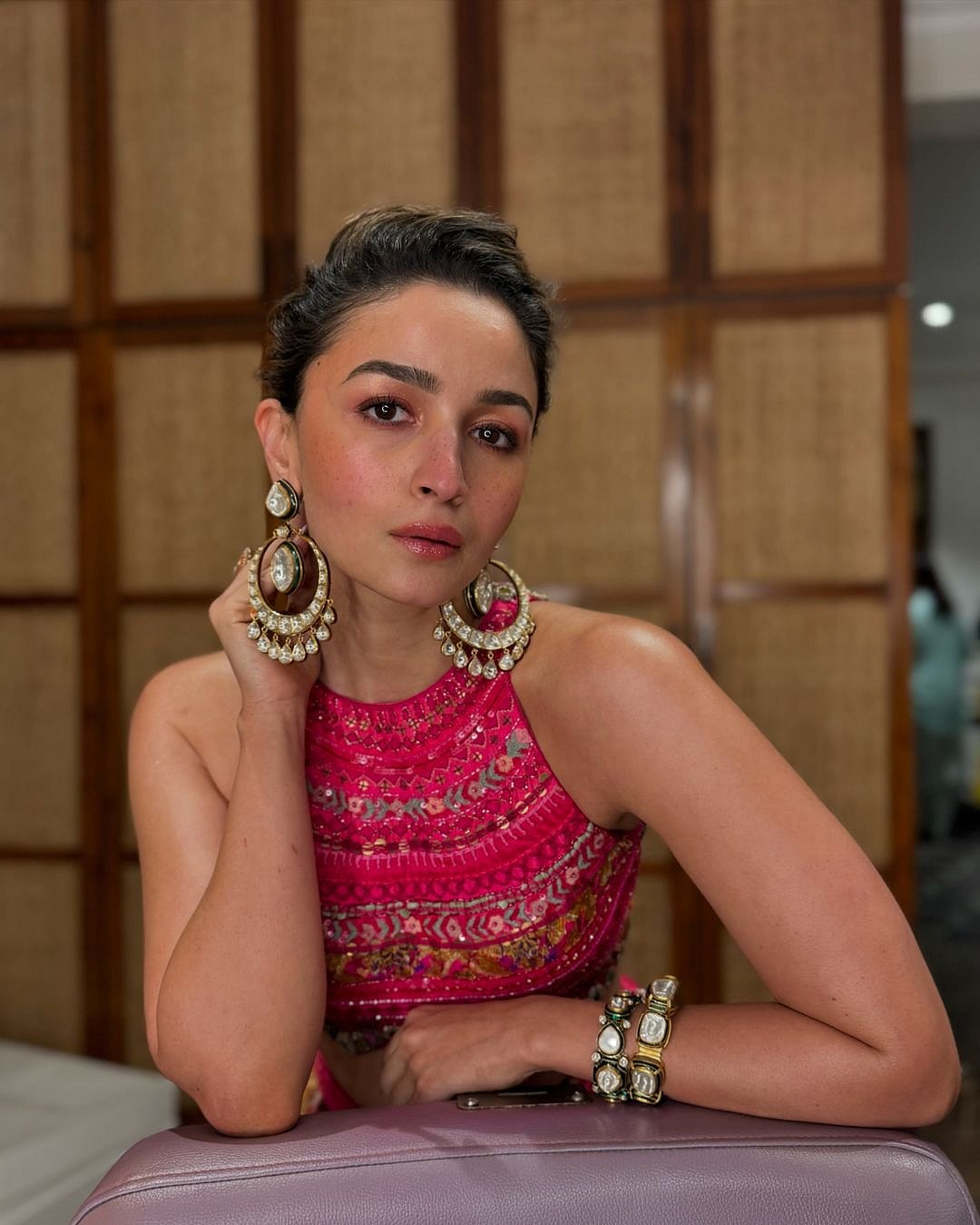 Alia Bhatt accessorised the lehenga with statement jhumkas and matching kadas
