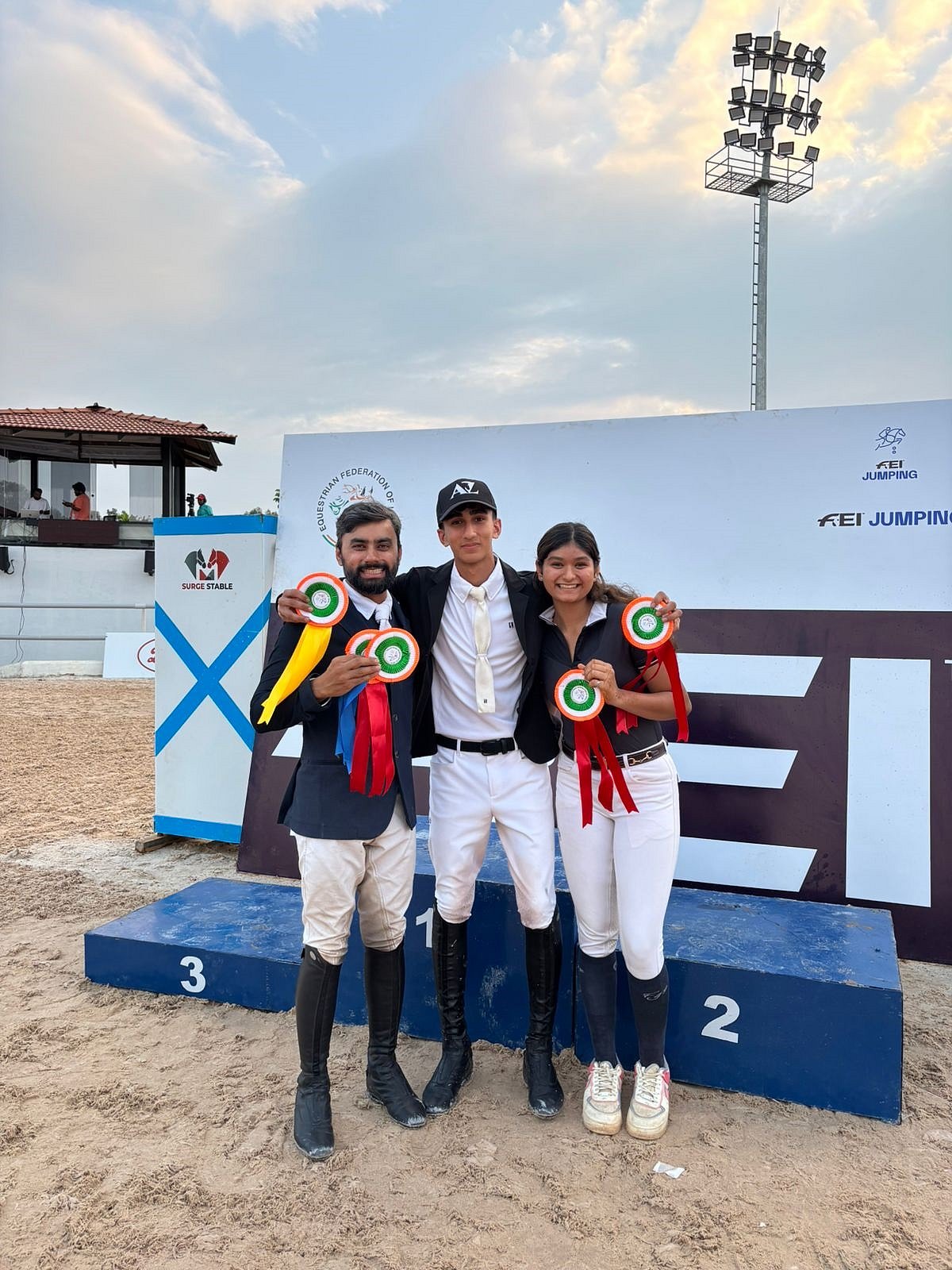 Winners of FEI Jumping World Challenge pose with the gold medals