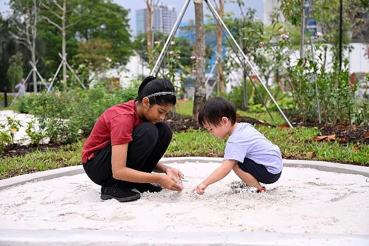 Children in the nature play area of Pek Kio Park.