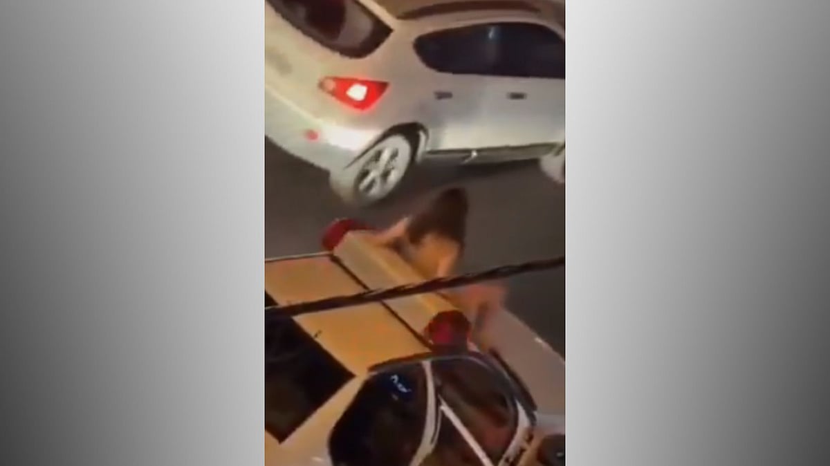 Iranian Woman strips naked in Mashhad (Screengrab)