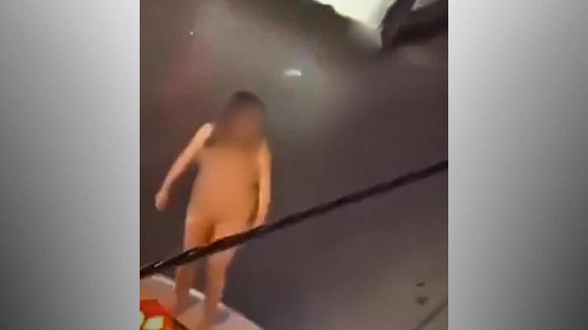 Iranian woman strips naked (Screengrab)