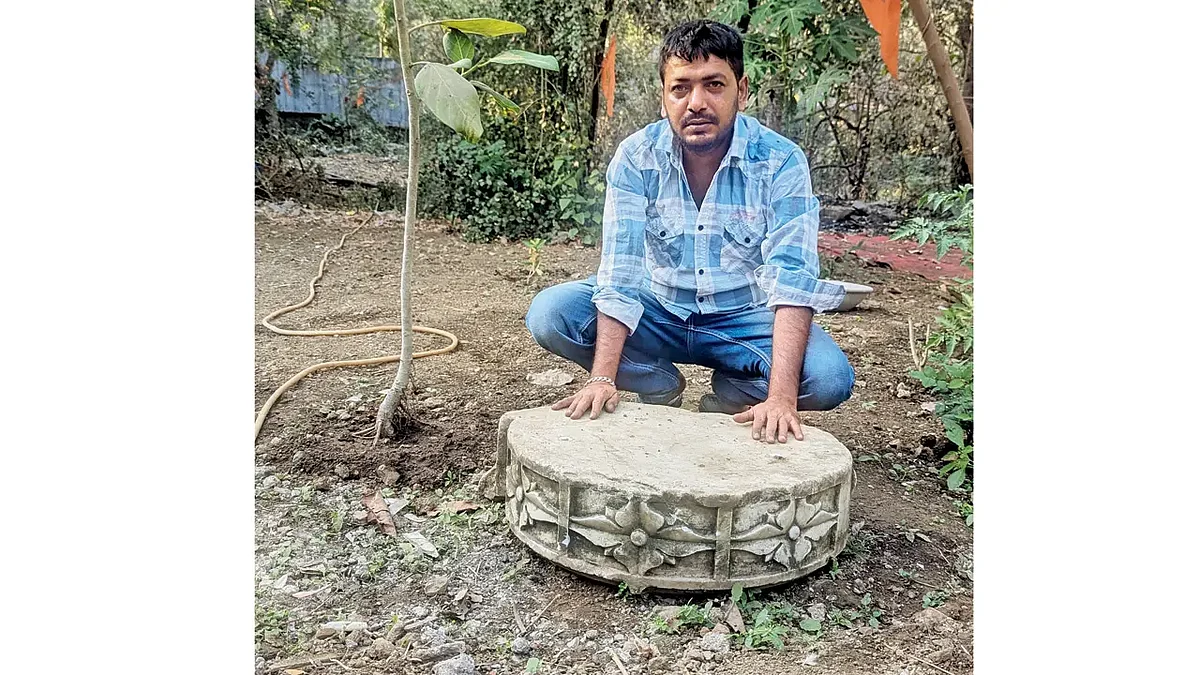 Juber Ansari with the discovered pedestal