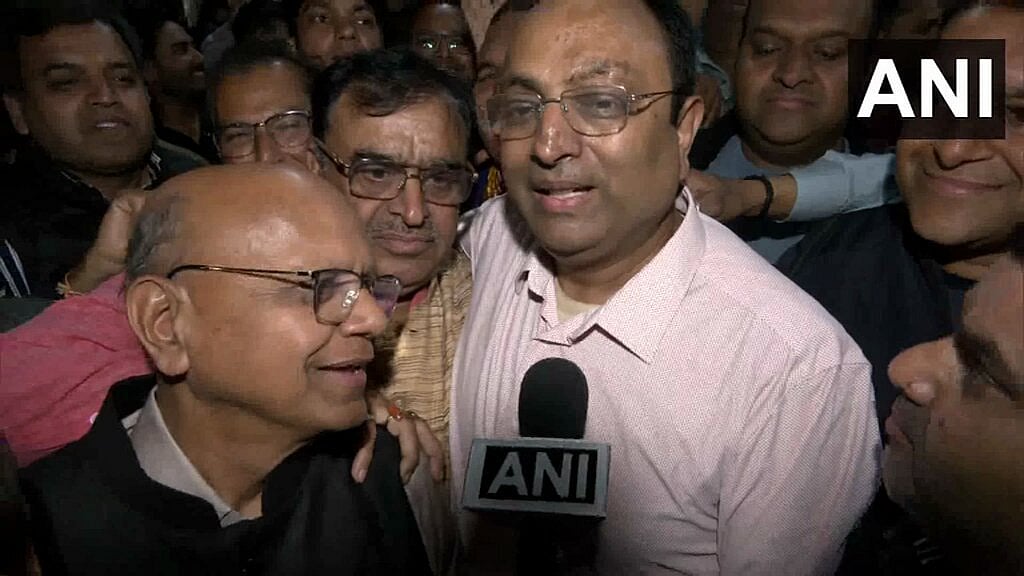 Manish Gupta (in light pink)