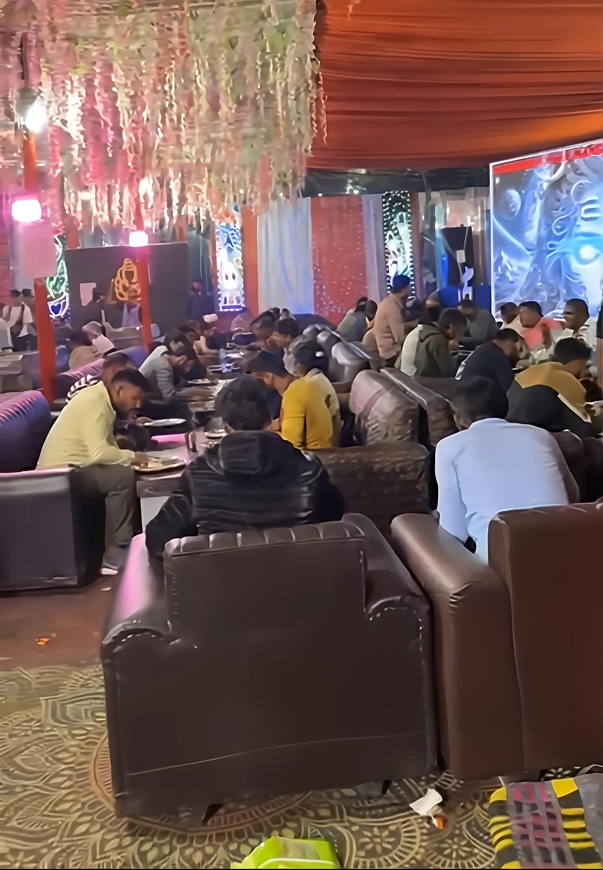 Devotees enjoying a warm meal at the langar