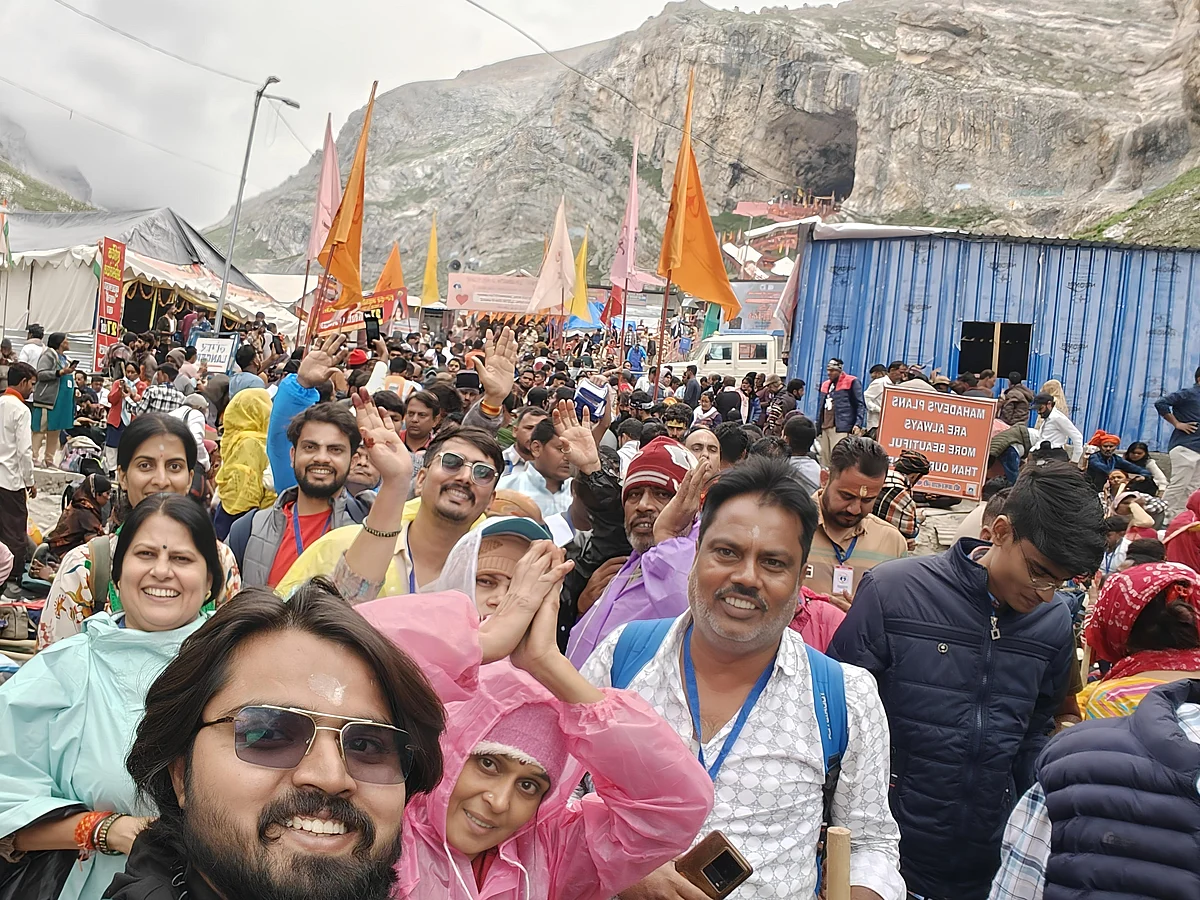 Devotees beaming with joy and devotion as they reach the holy Amarnath Cave