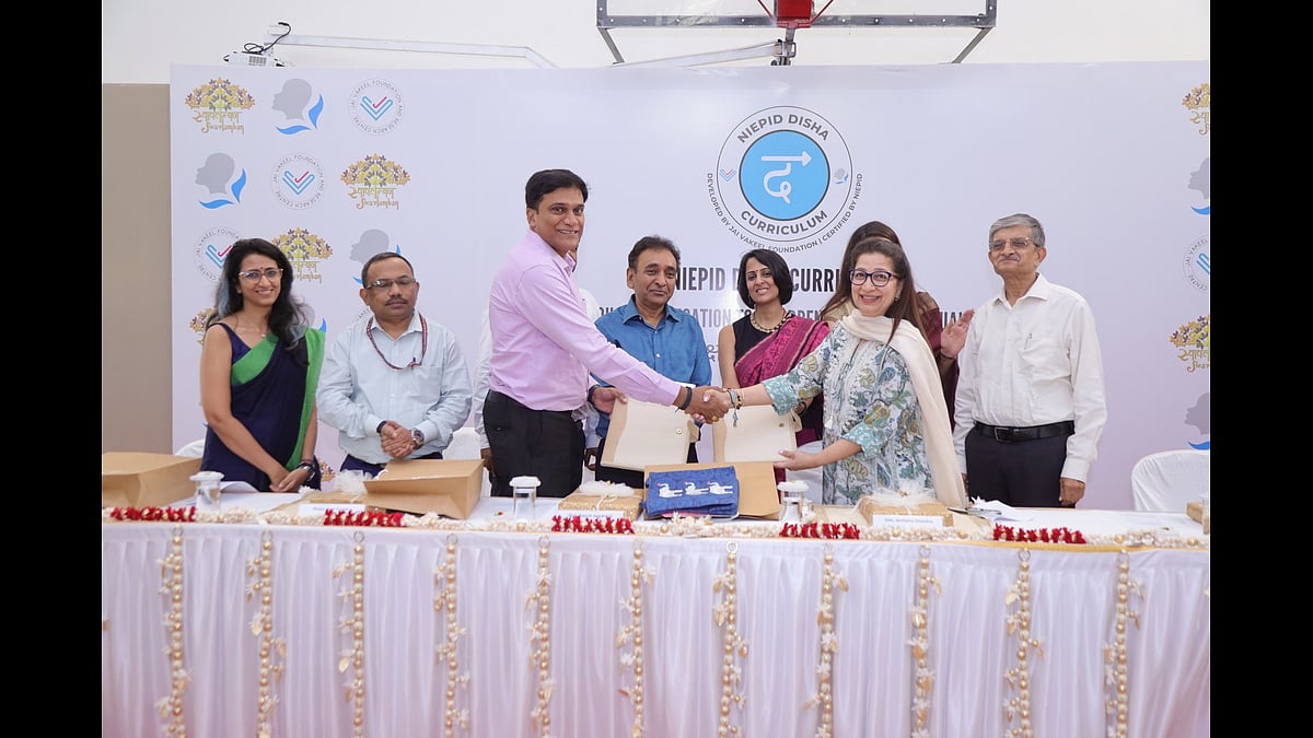 Maj. Dr. B.V. Ram Kumar and Archana Chandra shake hands