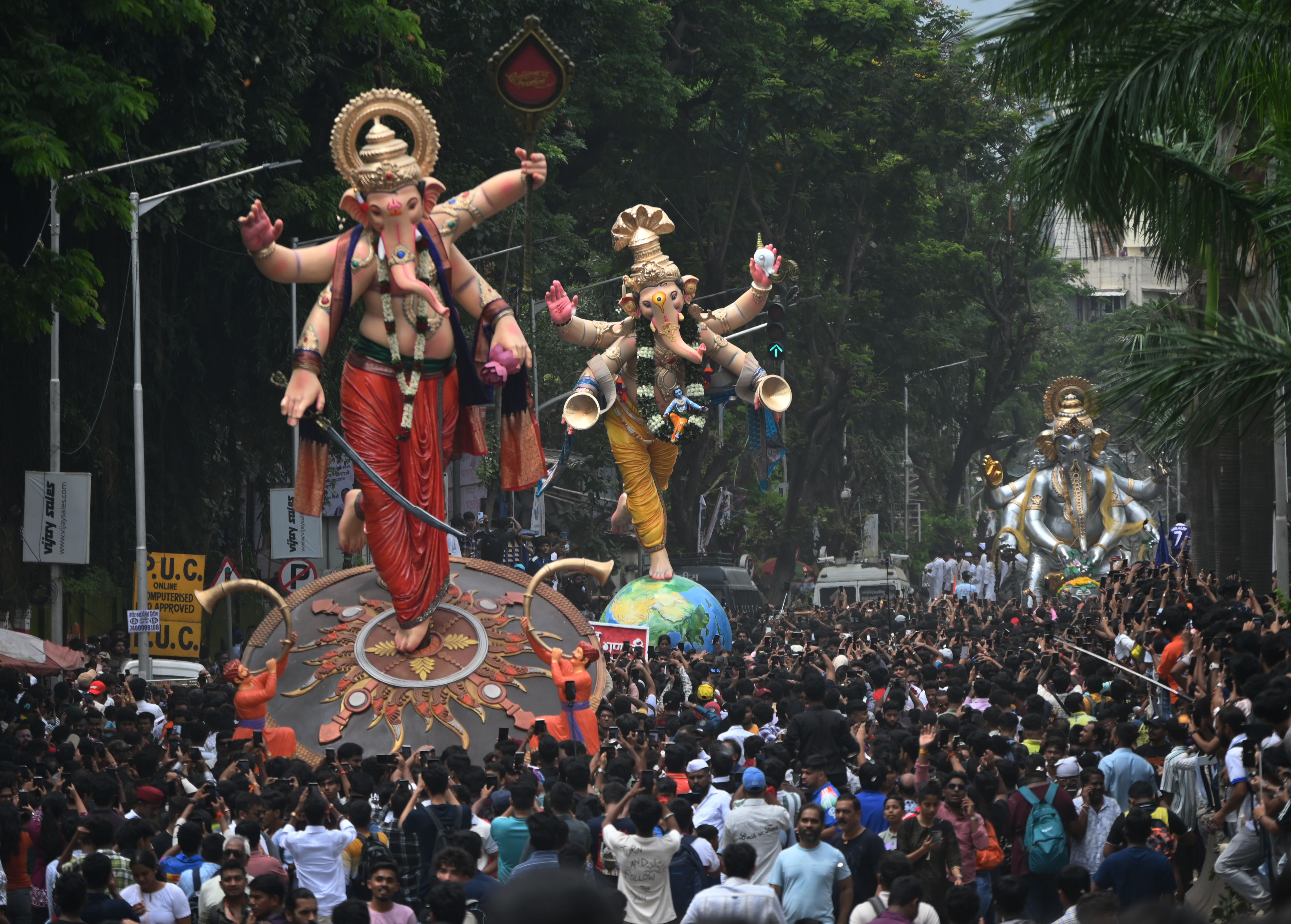 Devotees carry idols of Lord Ganesha from workshop at Parel 