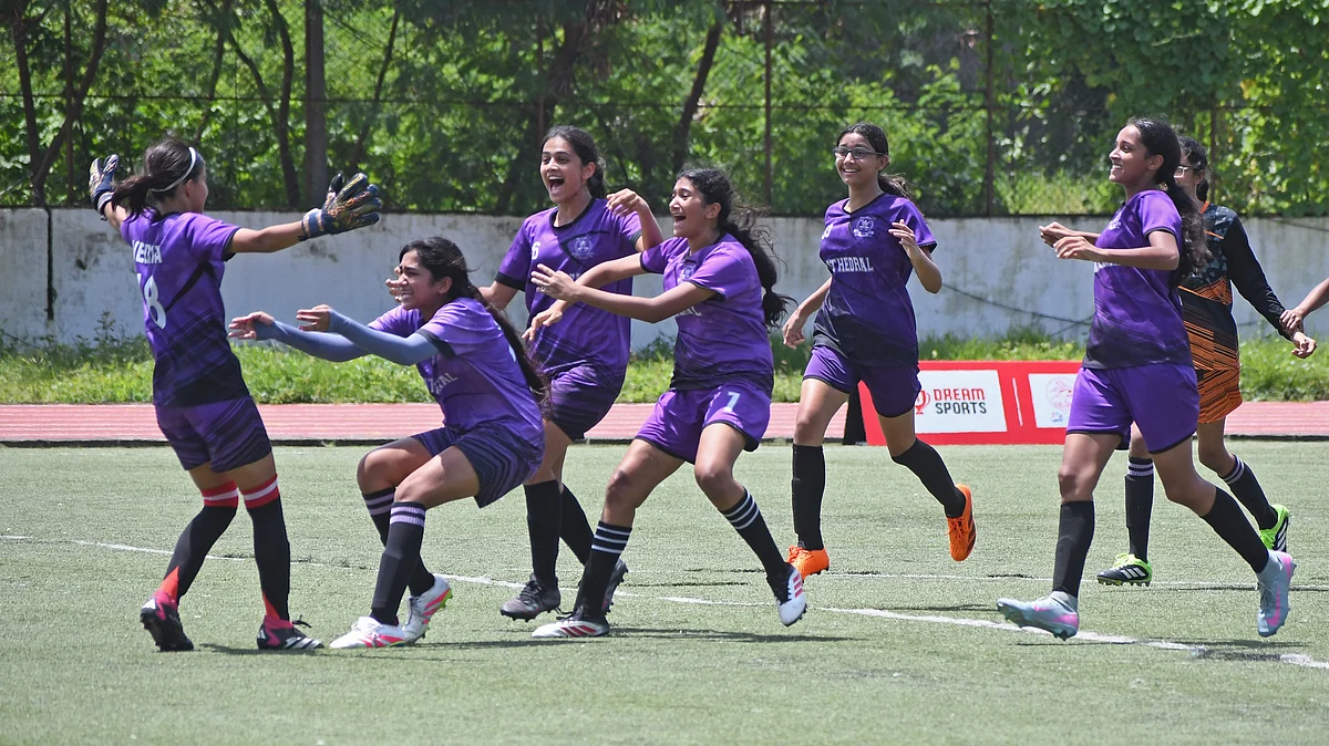 Cathedral and John Connon Fort skipper Vedita Kapadia (L) celebrates with teammates at Wings Sports Centre, Bandra on Tuesday.